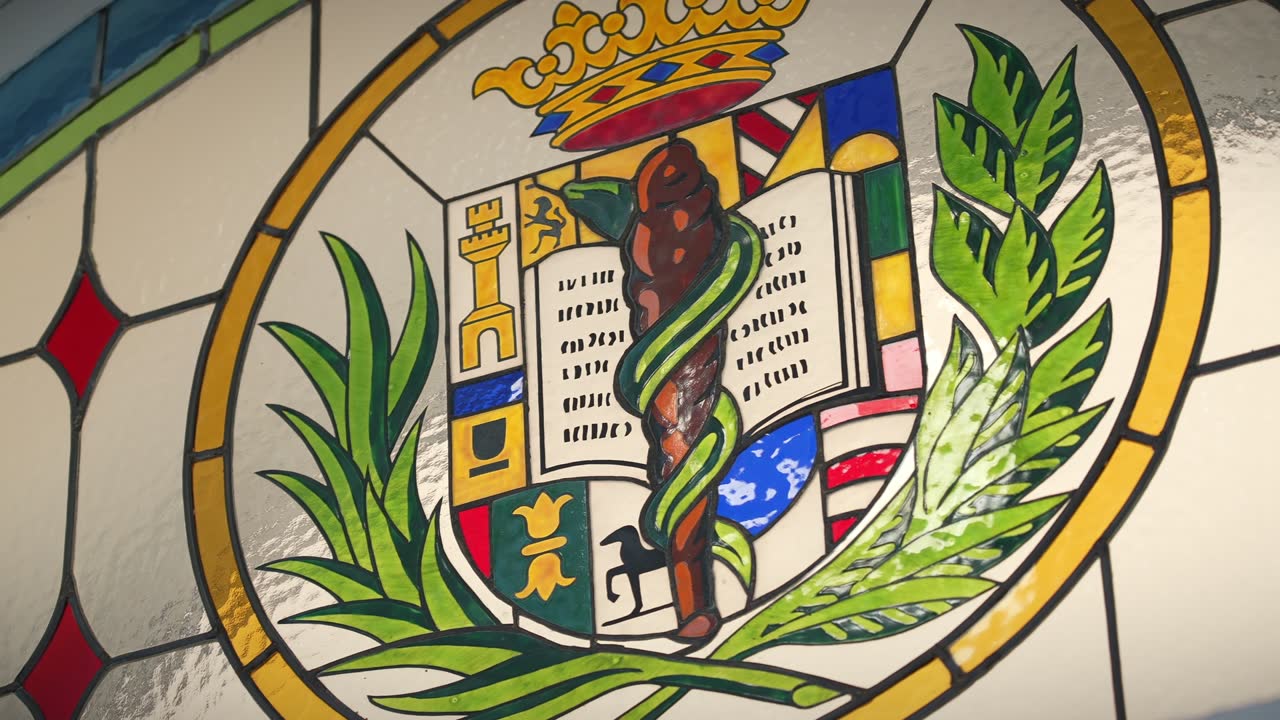 ICOMEM stained-glass crest